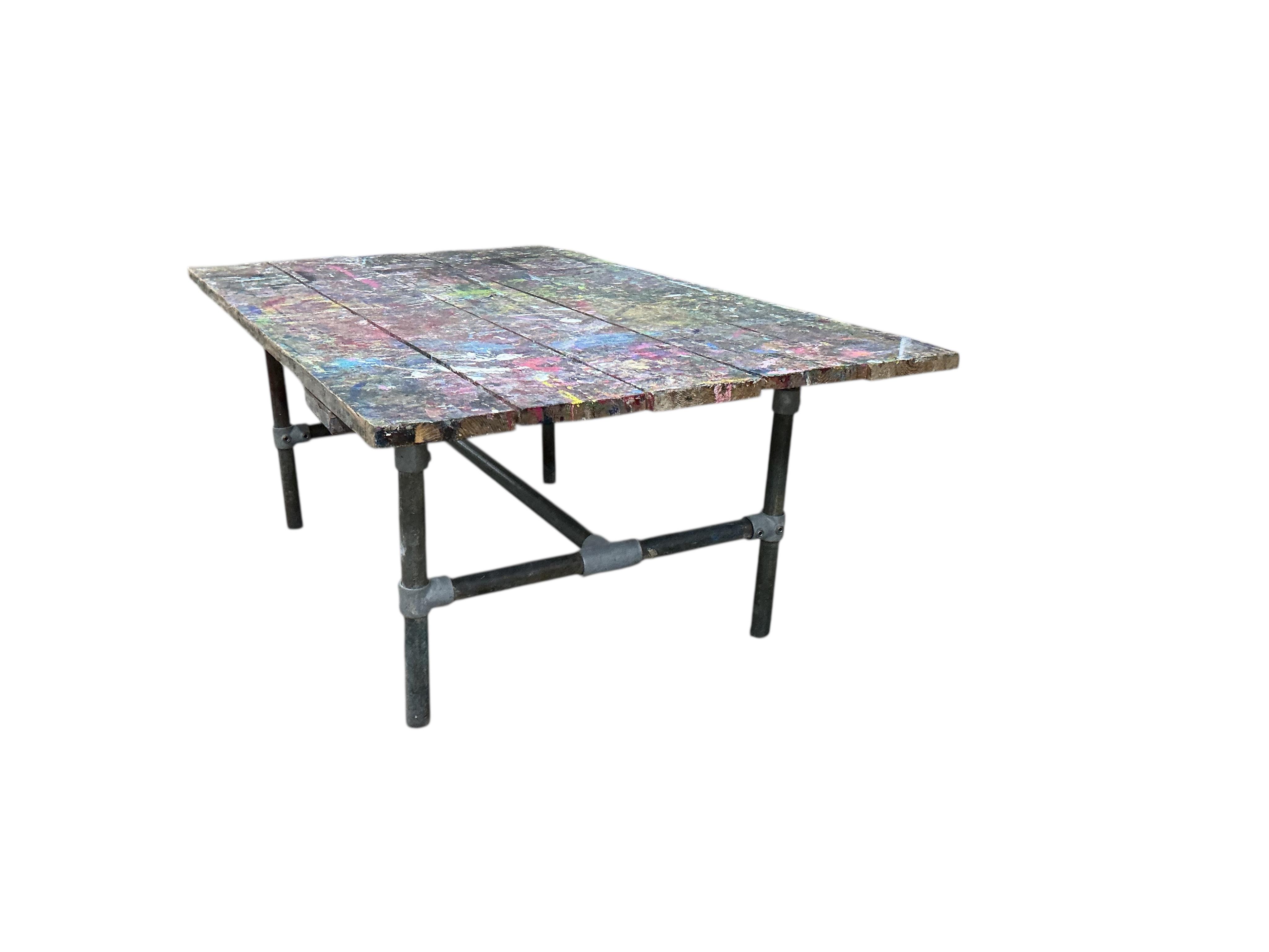 An industrial style rectangular artist's studio work table, width 195cm, depth 112cm, height 75cm
